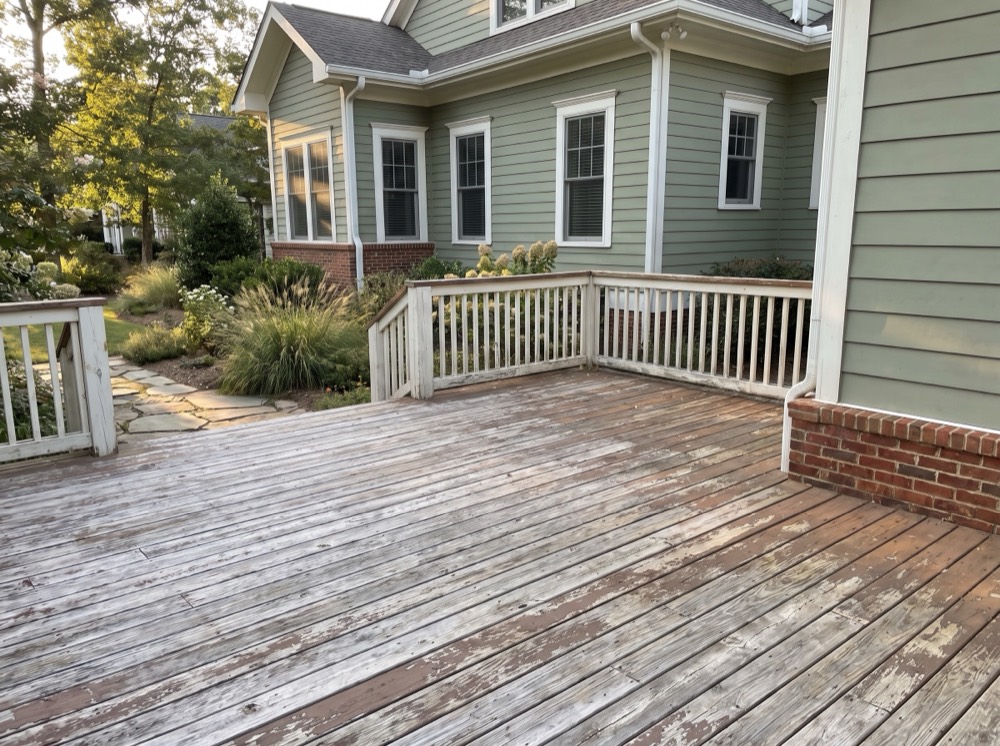 Weathered deck and exterior trim before restoration